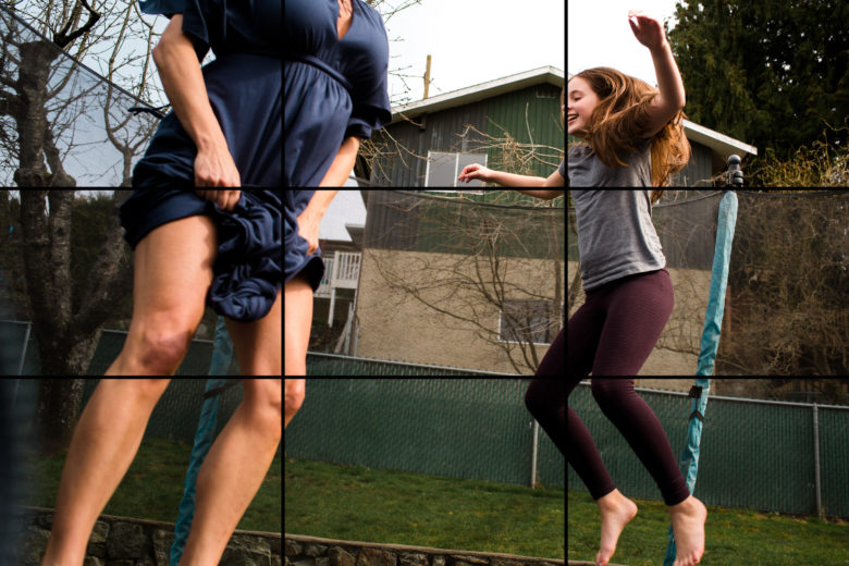 mother and daugther jumping on trampoline